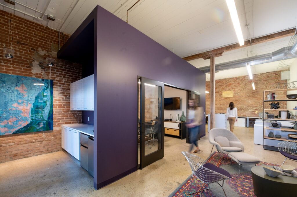 A dynamic office space with employees walking in and out